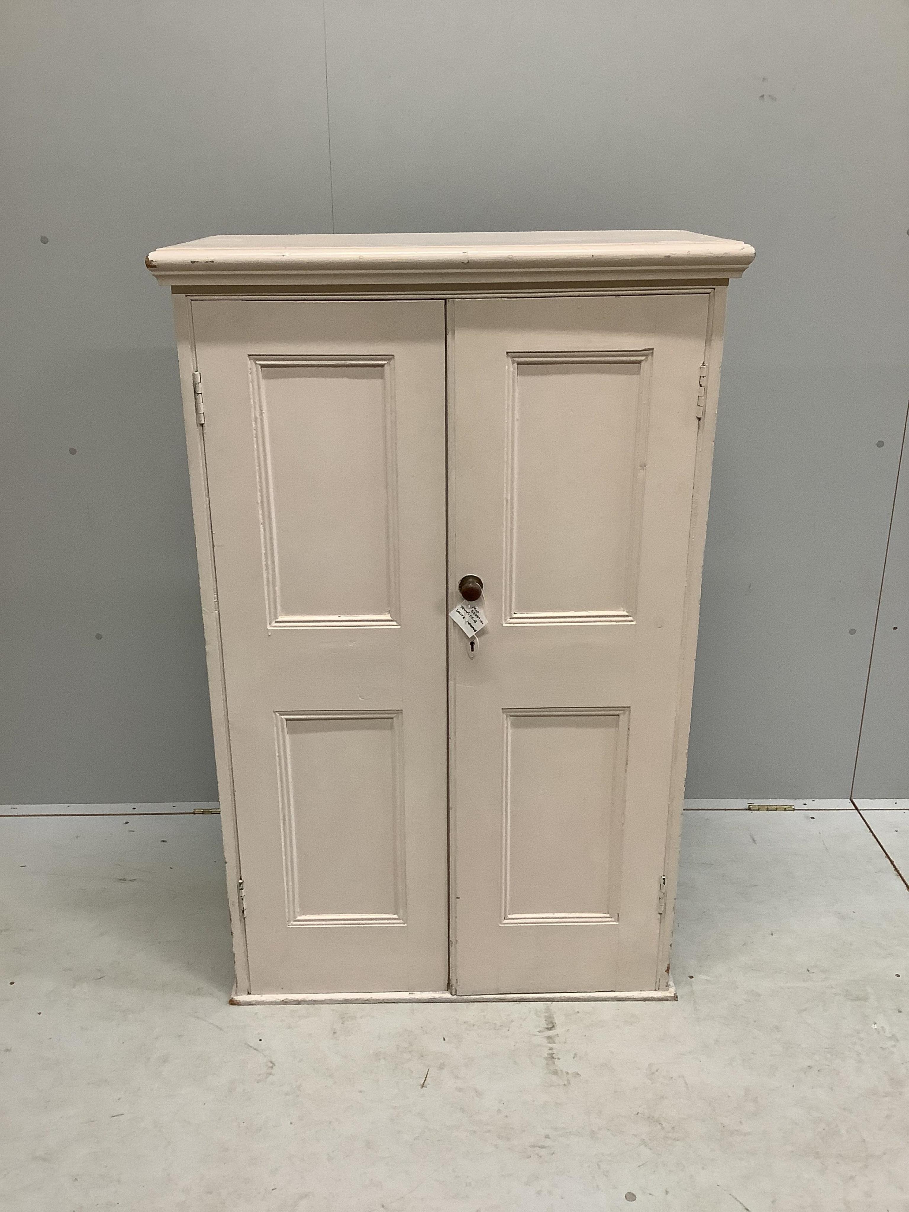 A Victorian painted pine panelled cupboard the interior with three shelves, width 86cm, depth 43cm, height 135cm. Condition - fair